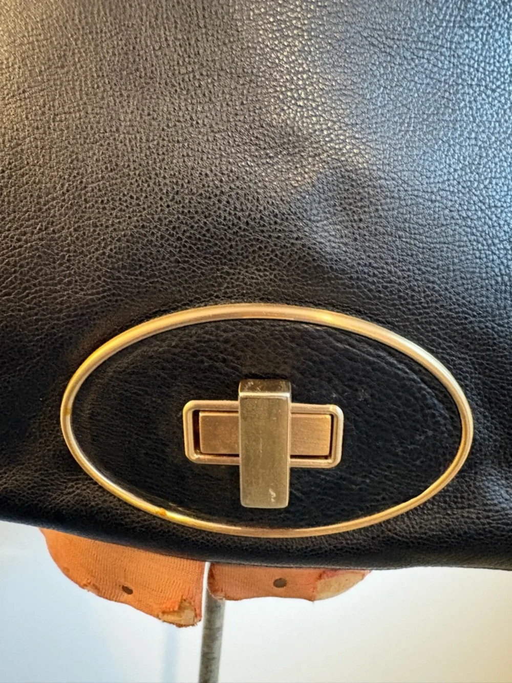 Cole Haan black leather messenger bag with gold hardware